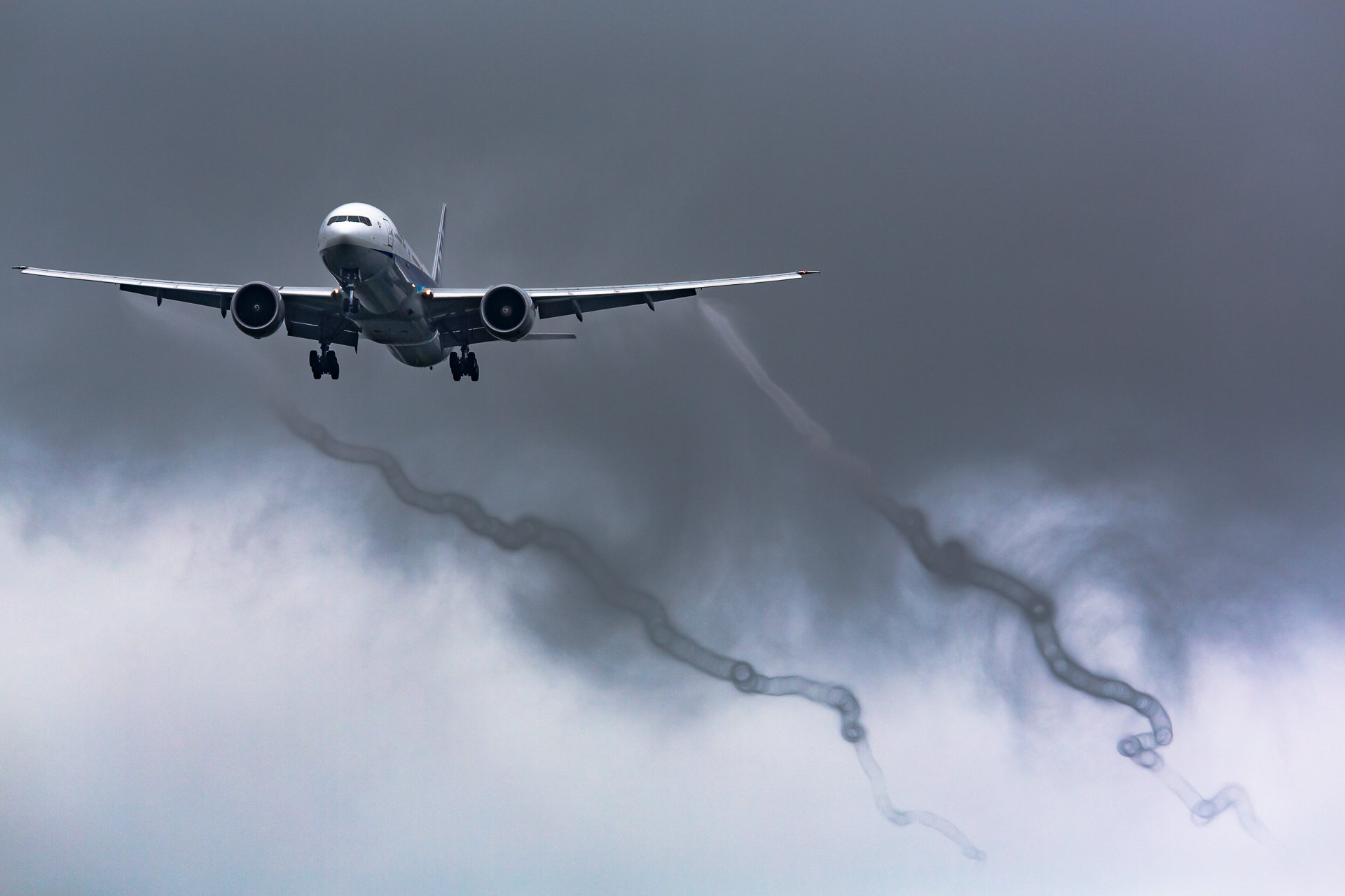 Aerodynamic wake contrails appearing from the wingtips