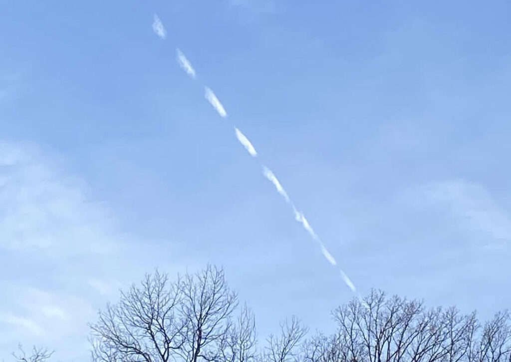 When a jet crosses an invisible boundary into different atmospheric conditions, the contrail appears and then stops.
