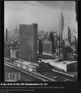 1956 – A sky shot of the UN headquarters (Contrails over the Empire State Building).
