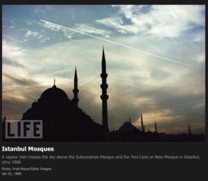 1988 – A vapour trail crosses the sky above the Suleymaniye Mosque and the Yeni Cami or New Mosque in Istanbul