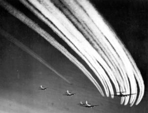 Contrails as a flight of B-17's joins another flight for a long-range mission